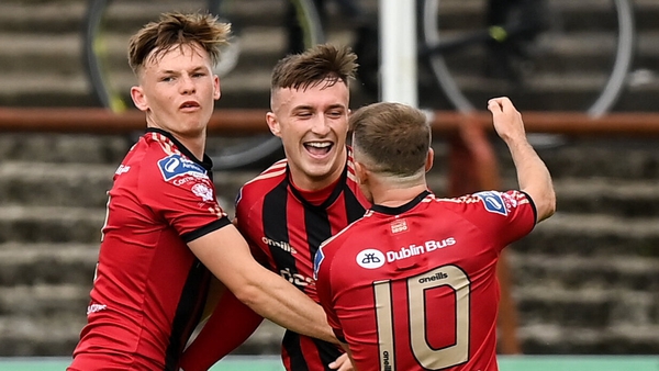 Danny Grant celebrates scoring with Bohemians team-mates Andy Lyons (L) and Keith Ward (R)