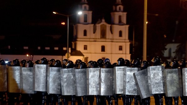 Riot police line up in Minsk after polls closed in Belarus' presidential election