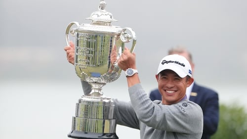 Collin Morikawa celebrates with the Wanamaker Trophy