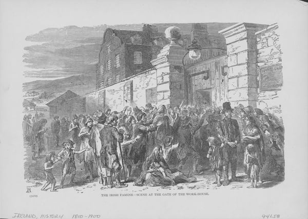 People begging to be allowed enter a workhouse in Ireland, circa 1846