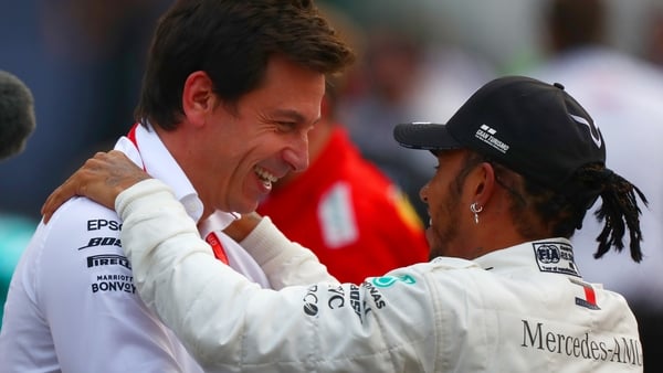 Mercedes team principal Toto Wolff (L) with Lewis Hamilton