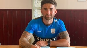 Sean Maguire pens his new deal.