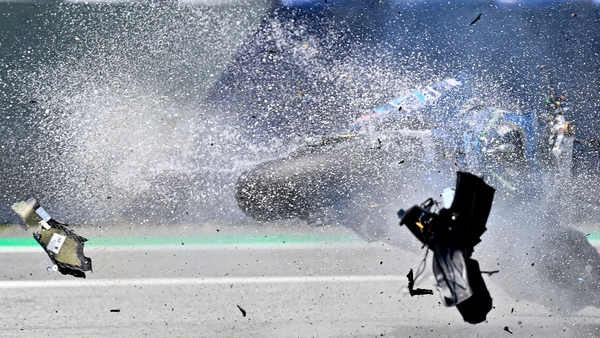 The bike of Italtrans Racing Team Italian rider Enea Bastianini is hit by another bike during the crash