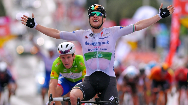 Sam Bennett celebrates as he crosses the line at the end of the third stage