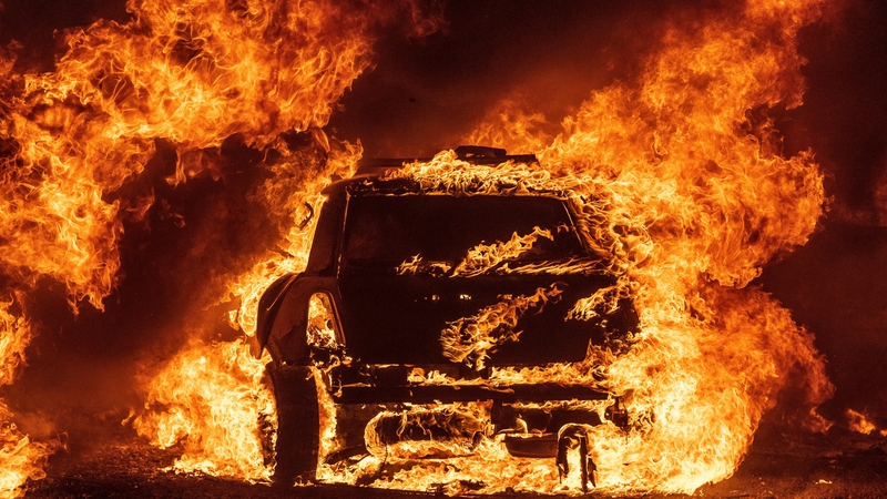 A car burns while parked at a residence in Vacaville, California