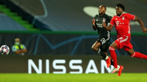 Bayern Munich's Alphonso Davies (R) in action against Olympique Lyon's Karl Toko Ekambi