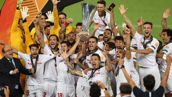 Sevilla celebrate with the Europa League trophy