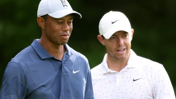Tiger Woods (L) and Rory McIlroy pictured together in 2020