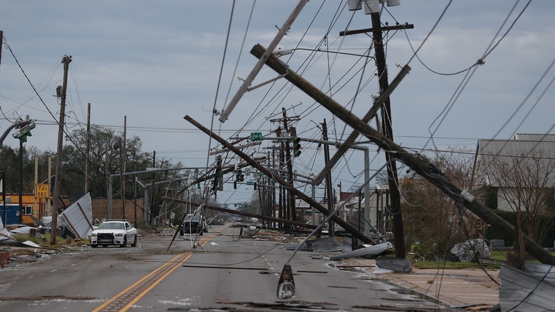 A street is seen strewn with debris and downed power lines after Hurricane Laura passed through Lake Charles, Louisiana