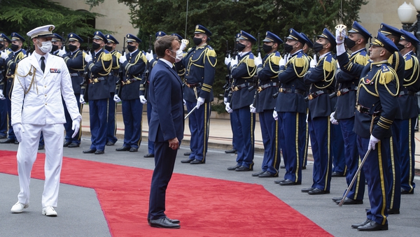 Emmanuel Macron inspects an honour guard as he arrives for a meeting in Baabda, Lebanon, today