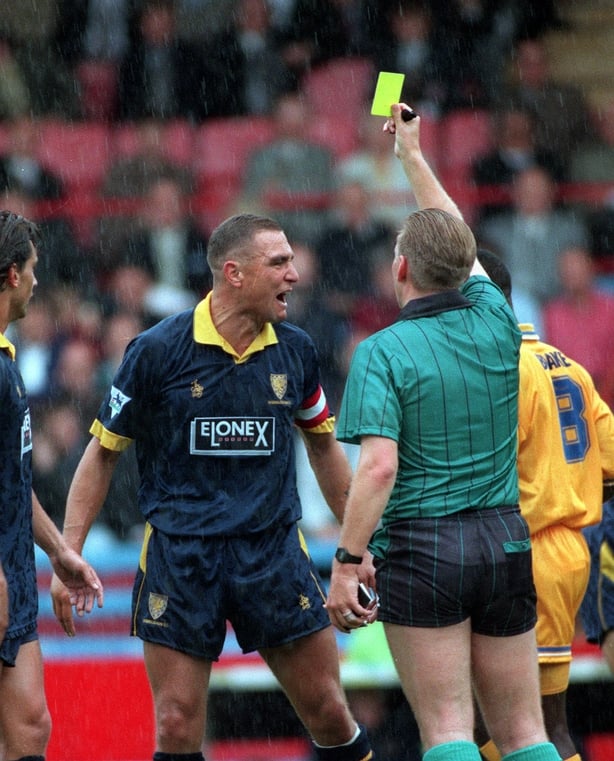 Then Wimbledon captain Vinnie Jones gets a yellow card