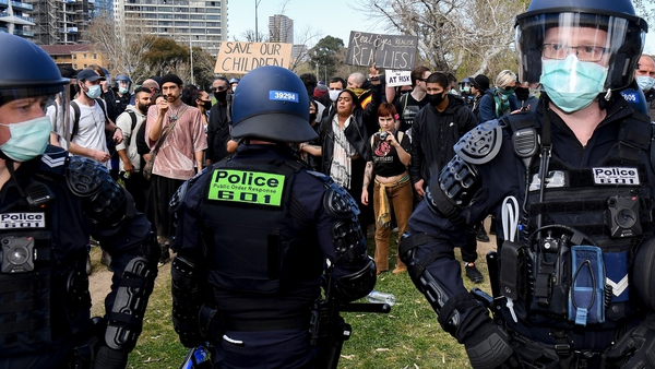 Australian police have arrested more than a dozen protesters in Melbourne for deliberately flouting the city's stay-at-home orders