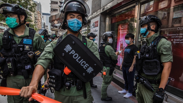 Police on patrol in Hong Kong amid flash protests against the decision to postpone legislative council elections