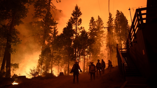 Firefighters battle the Creek Fire in Fresno, California