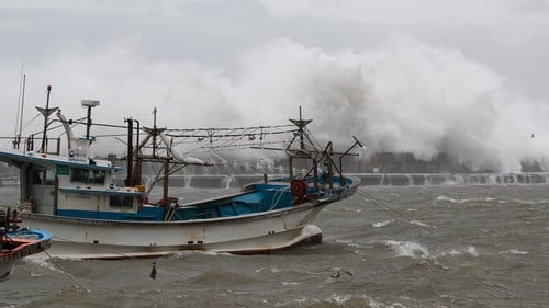 Large waves break over a coastal wall at Imwon harbour in Donnghae, Gangwon-do province, South Korea
