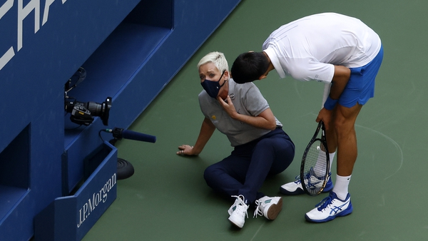 Djokovic checks on the line judge after hitting her with a ball