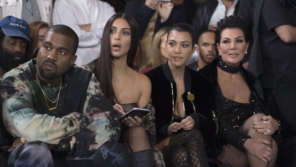(L-R) Kanye West and wife Kim Kardashian, along with Kourtney Kardashian and Kris Jenner