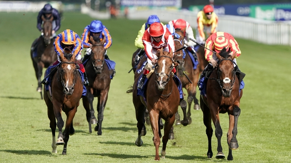 Tom Marquand riding Galileo Chrome (R) win The Pertemps St Leger Stakes