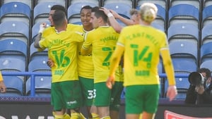 Adam Idah celebrates with his Norwich team-mates as they won on the opening day at Huddersfield