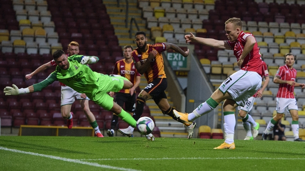 Lincoln City's Anthony Scully scores his side's second goal in their drubbing of Bradford