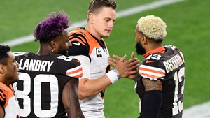 Joe Burrow (C) greets Odell Beckham Jr (R) of the Cleveland Browns after the game
