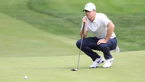 Rory McIlroy lines up a putt at Winged Foot