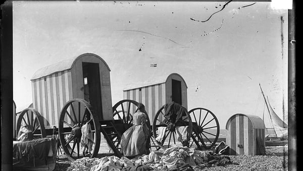 Bathing machines on a beach circa 1900. Photo: RTÉ Photographic Archive