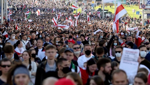People march during a demonstration called by opposition movement for an end to the regime of Alexander Lukashenko