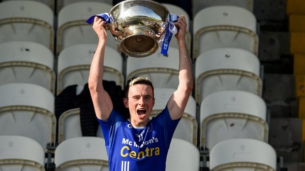 Scotstown captain Shane Carey lifts the Mick Duffy Cup