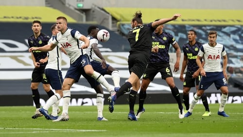 Newcastle won a penalty after Andy Carroll headed the ball at Eric Dier's arm