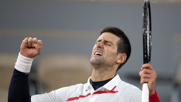 A jubilant Novak Djokovic celebrates his victory against Pablo Carreno Busta
