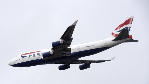 A British Airways Boeing 747 aircraft makes a flypast over London Heathrow airport on its final flight today