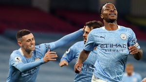 Raheem Sterling (R) celebrates what proved to be the only goal