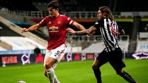 Harry Maguire shielding the ball from Newcastle and Ireland's Jeff Hendrick