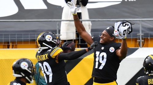 Minkah Fitzpatrick of the Steelers celebrates with JuJu Smith-Schuster after his pick-six against the Browns and an out-of-sorts Baker Mayfield