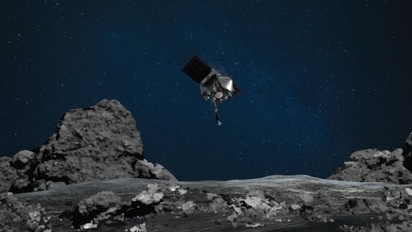 An artist's rendering shows OSIRIS-REx descending towards Bennu to collect a sample of the asteroid's surface