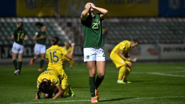 Ruesha Littlejohn holds her head in her hand at the final whistle in Kyiv