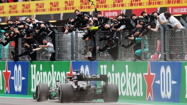 Lewis Hamilton crosses the finish line to win in Portugal
