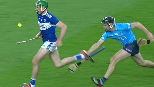 Dublin's Danny Sutcliffe trips Laois' Paddy Purcell