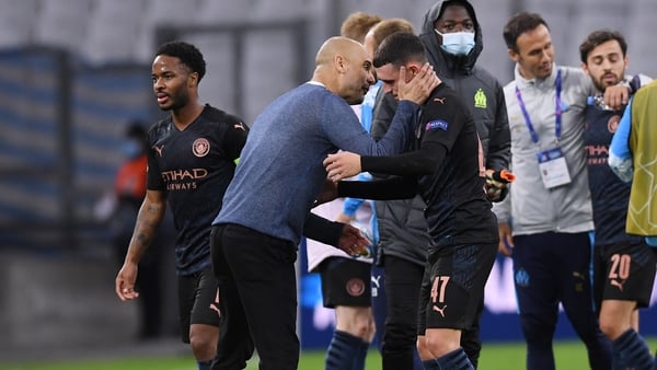 Pep Guardiola congratulates his players, including Phil Foden, after the win over Marseille