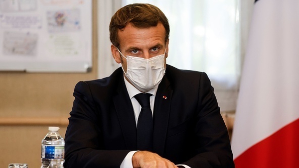 President Emmanuel Macron said 'exposed' groups would be vaccinated first next year