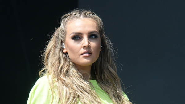 Perrie Edwards has revealed she is suffering with back pain