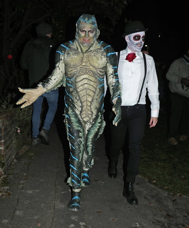 Alan Carr (left) and his husband Paul Drayton leaving a Halloween party hosted by Jonathan Ross