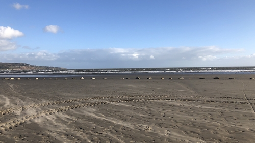 The man was kite surfing at Dollymount Strand