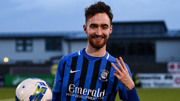 Dean George with the match ball after his hat-trick against Shelbourne