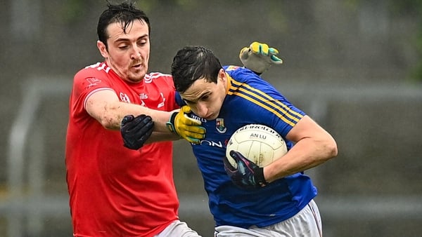 Darren Gallagher rounds Tommy Dunne in Longford's narrow win over Louth
