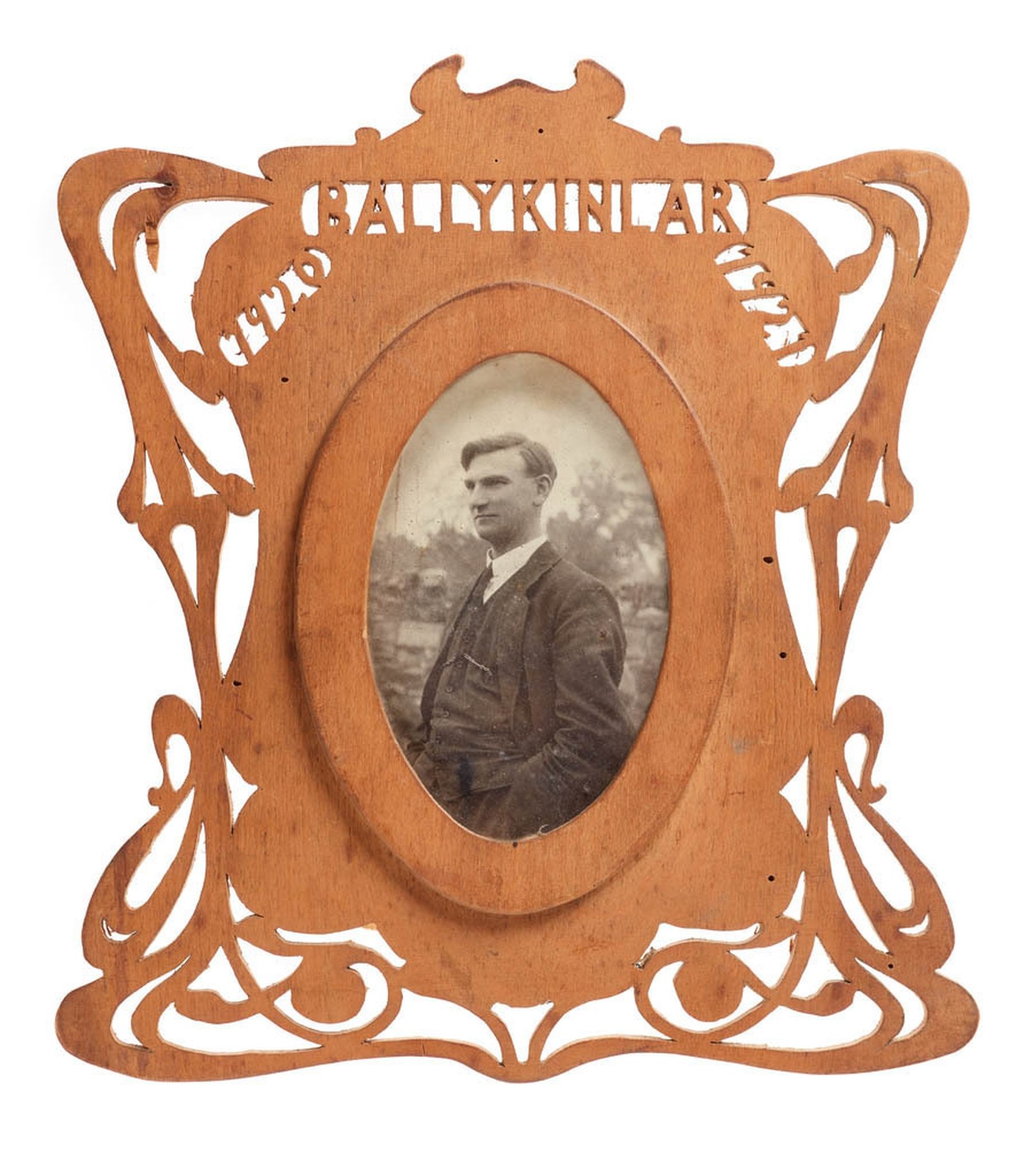 Image - Photograph of Mr. Joseph McGrath in carved frame. Image courtesy of the National Museum of Ireland HE:EW.598