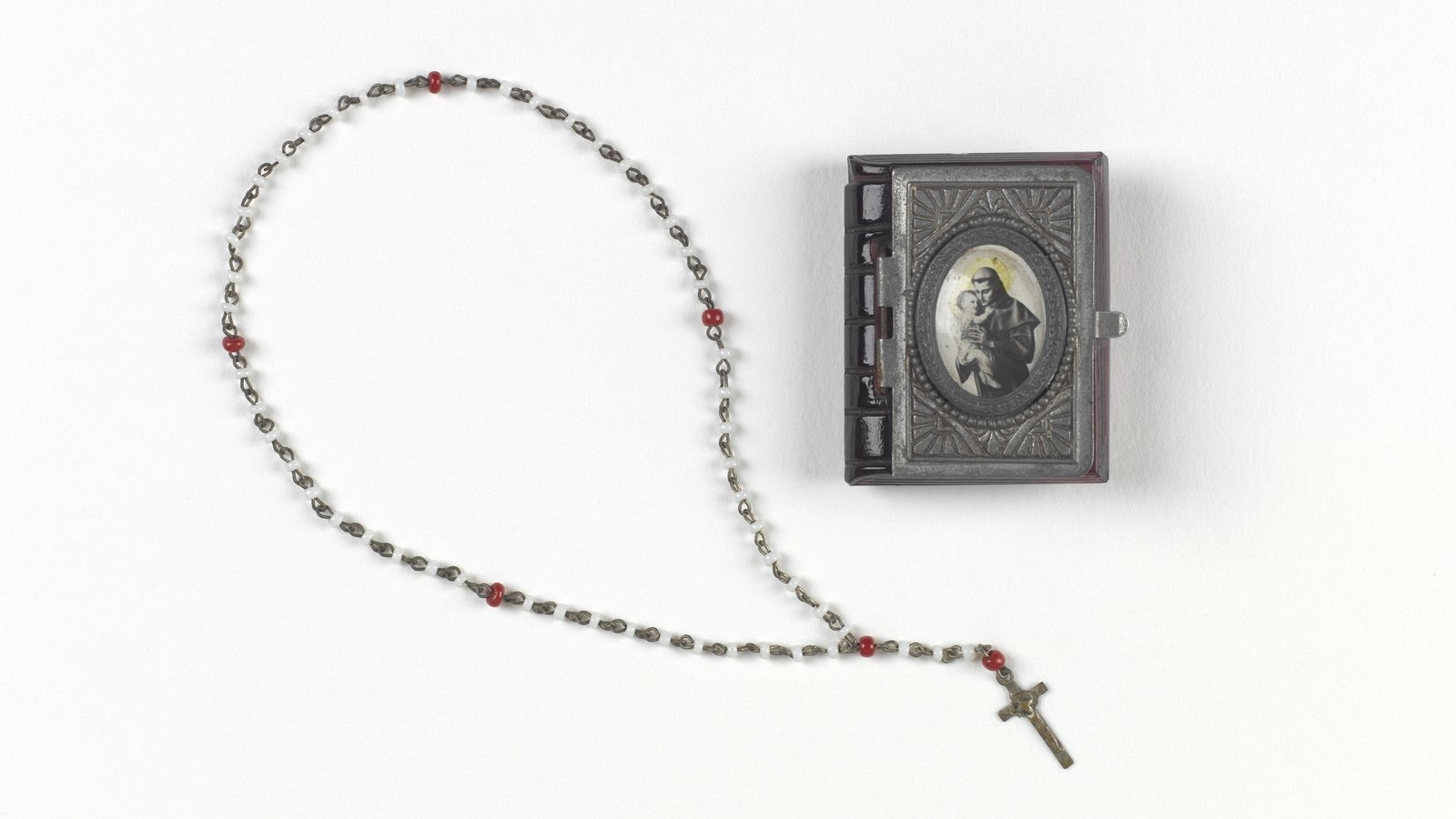 Image - Kevin Barry's rosary beads and case. Image courtesy of the National Museum of Ireland HE:EWT.346