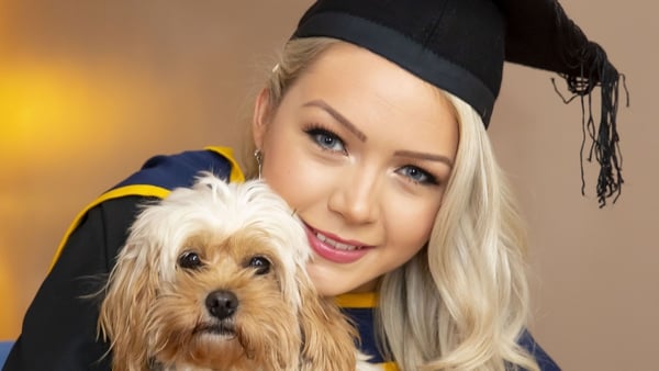 Grace Nolan from Tullow, Co Carlow pictured at home with her dog Teddie before her online conferring ceremony