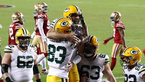 Marquez Valdes-Scantling (no 83) celebrates a touchdown reception with Aaron Rodgers